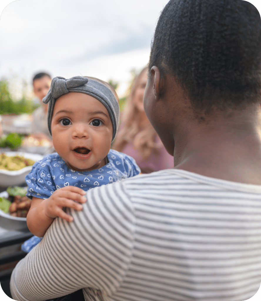 parent holding baby